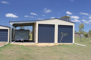 Double bay garage with a carport on the side big enough for a caravan!