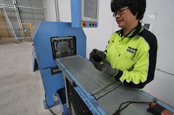 Factory worker on the 90mm Enduroframe machine